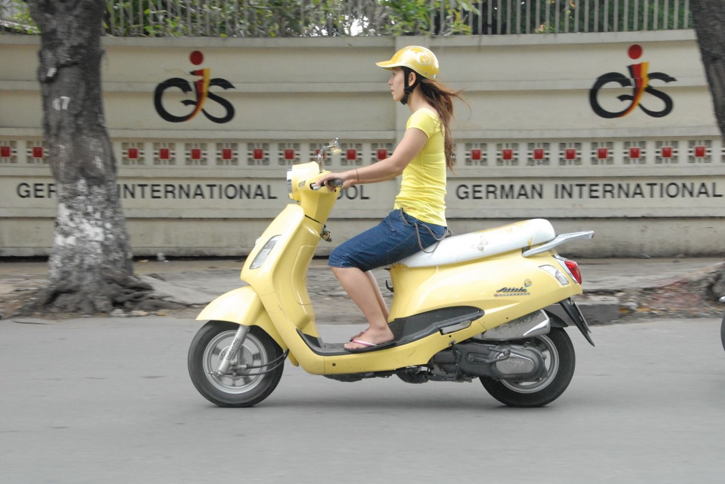 Woman riding scooter