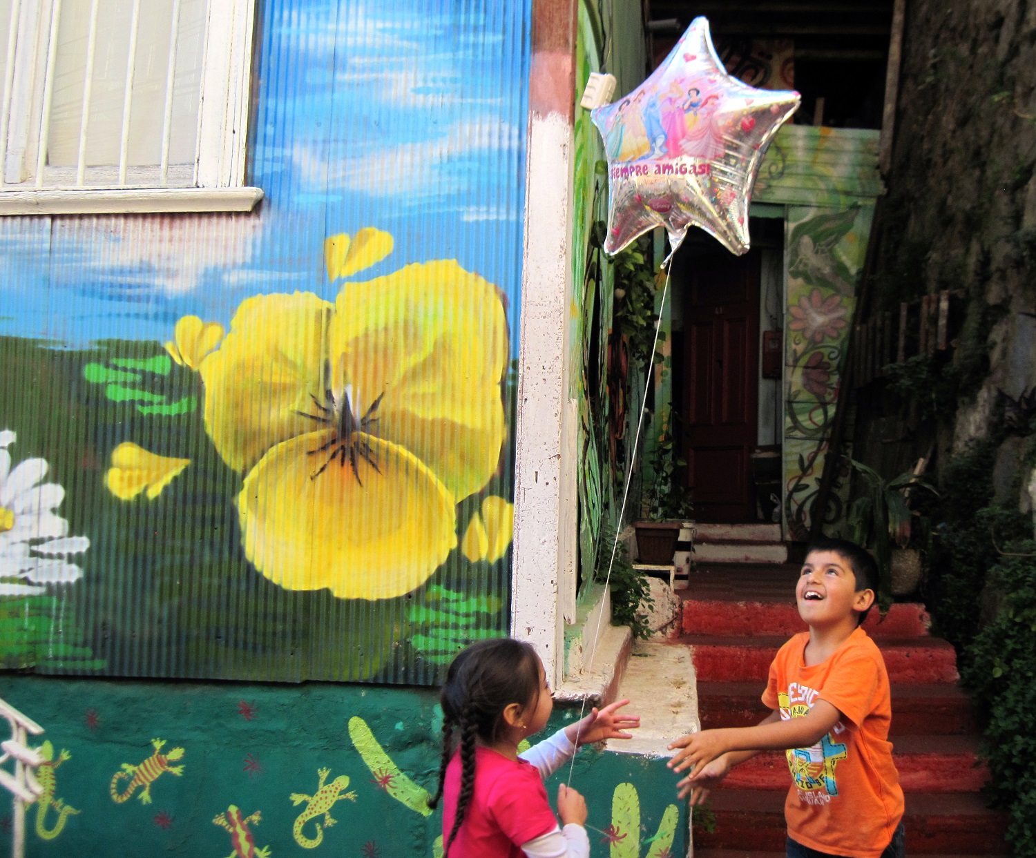 kids playing with balloon