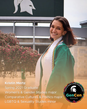 Kristin Mertz posing in a green graduation gown in front of the Spartan Stadium