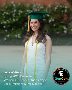 Julia Walters smiling in a green graduation cap and white dress
